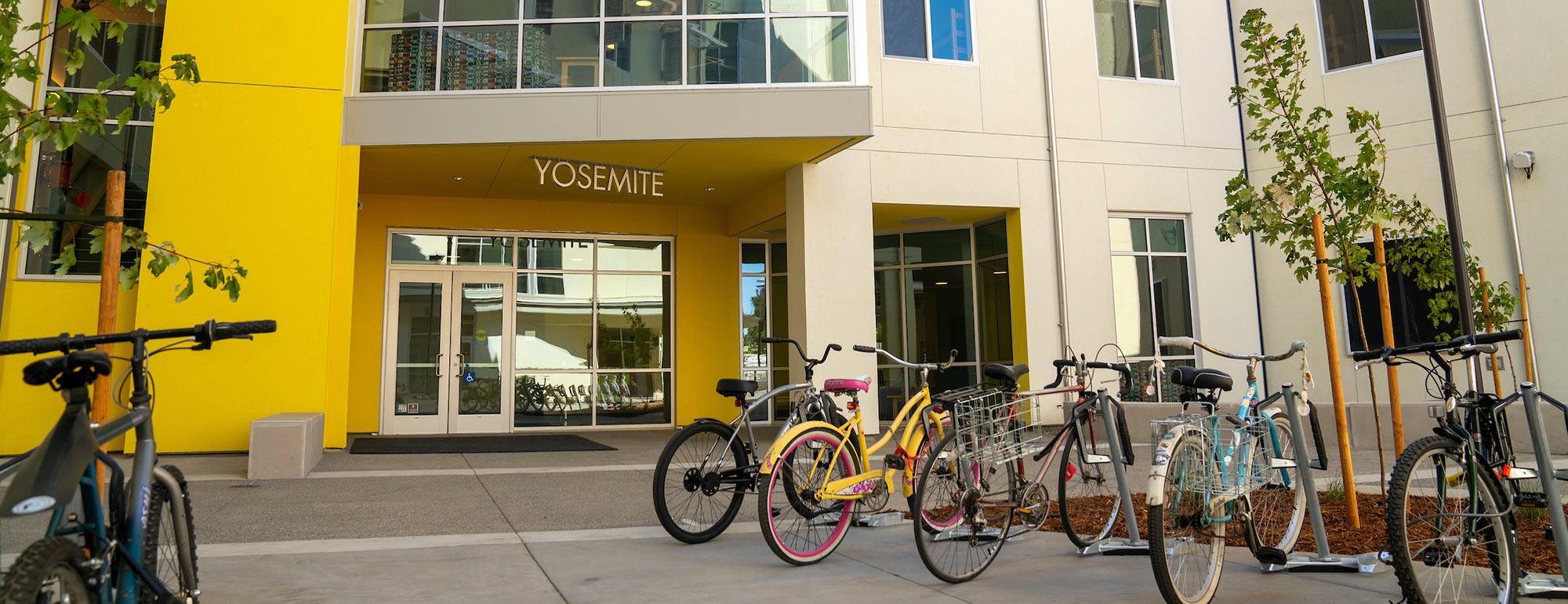 A view of a bike parking area just outside the entrance to Yosemite hall 